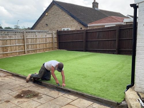 Installing Fake Grass In A Garden in Clare